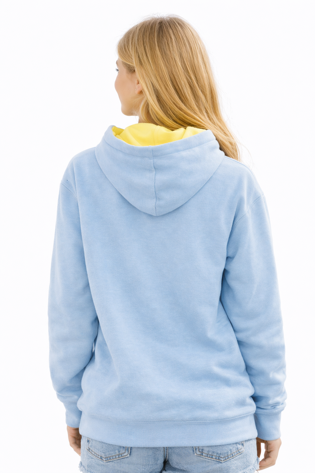 Person wearing a light blue hoodie with a yellow interior on a white background
