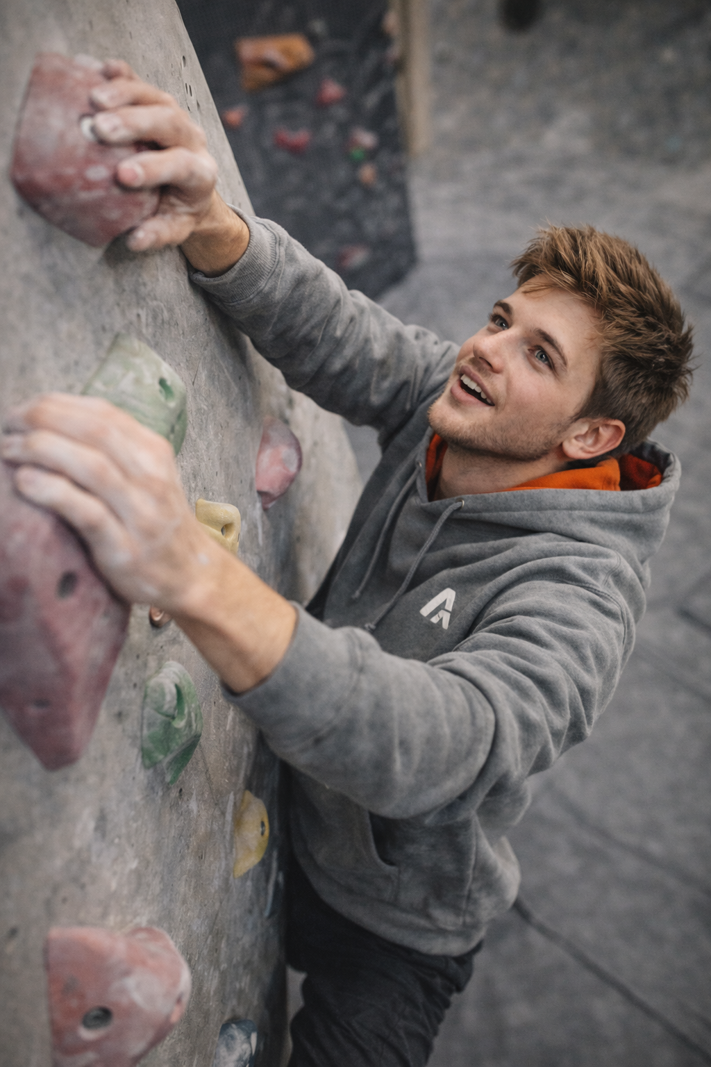 Person climbing a rock wall indoors