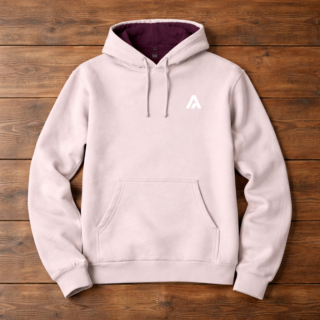 Light gray hoodie with a logo on a wooden surface