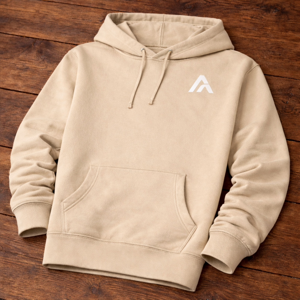 Beige hoodie with a logo on a wooden surface
