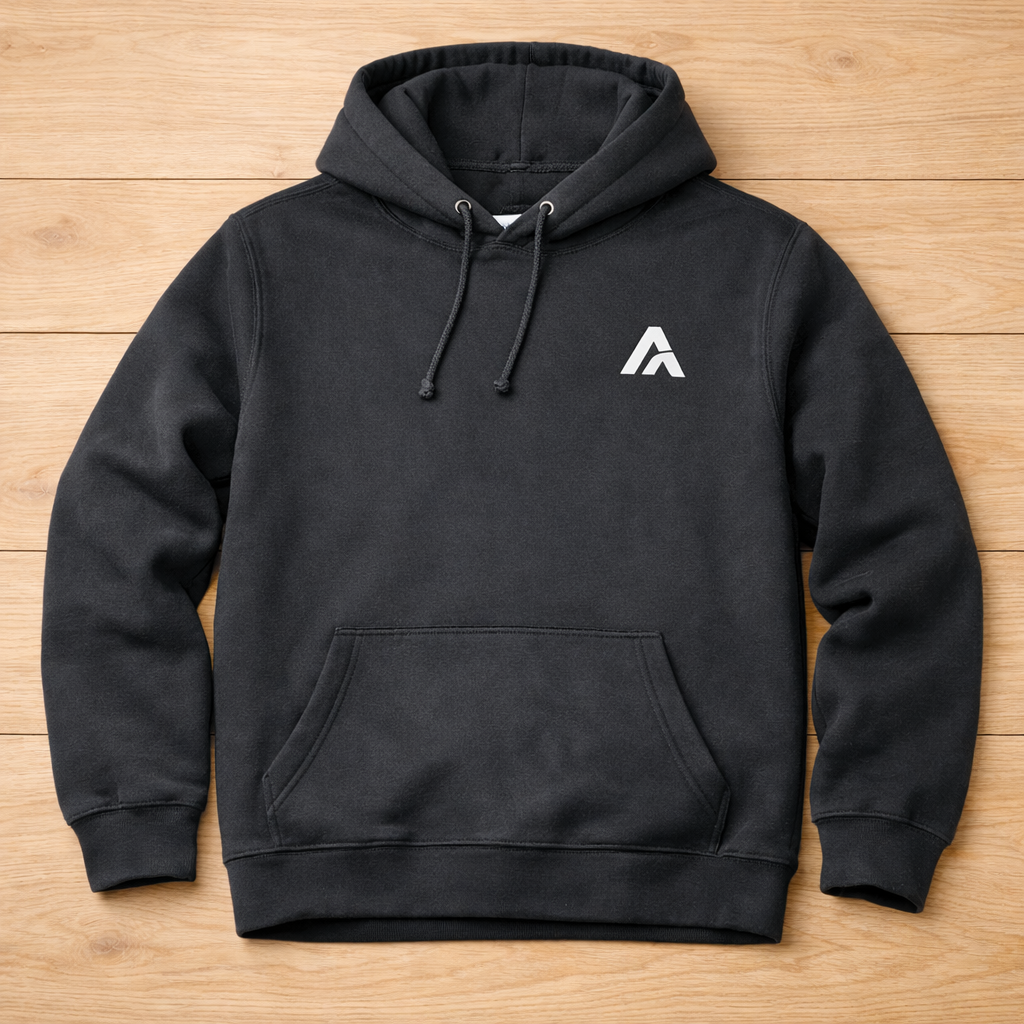 Black hoodie with a white logo on a wooden surface