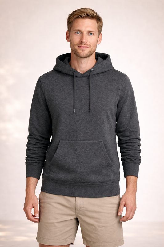 Front view of a man wearing a dark heather gray pullover hoodie with drawstrings and kangaroo pocket.
