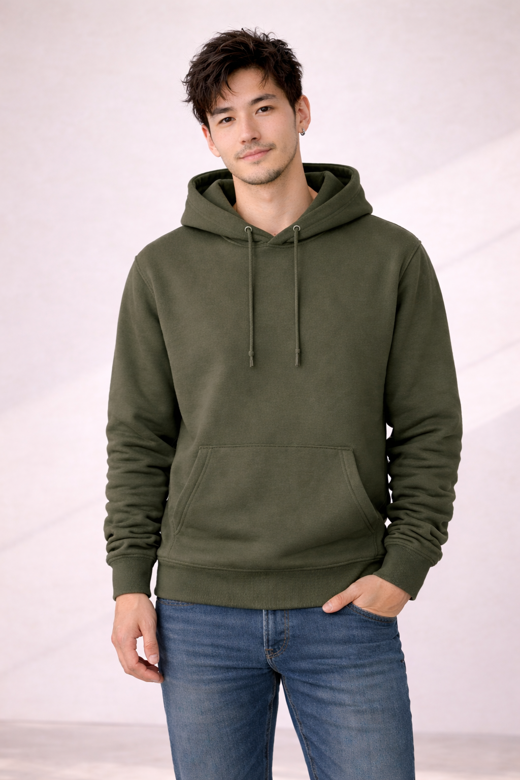 Front view of a man wearing a plain olive green pullover hoodie with drawstrings and kangaroo pocket.